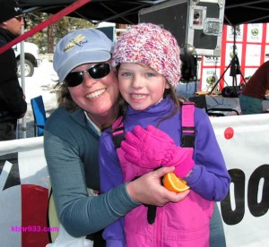 Eight-year-old Carissa Wolcott, with proud mom Jamie, won the kids race on snowshoes.