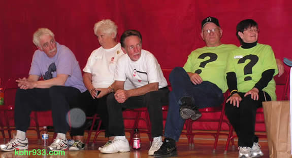 The Man About Town candidates, on the sidelines during a time-out in the fun Friday night game against the Harlem Ambassadors: (from left) Paul Ortuno, Helen Walsh, Ace Evers, Phil and Sue Hamilton.