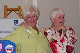 Twice as nice: Helen Walsh is joined at the podium by Dottie Suhr, disproving that the look-alikes are one Soroptimist
