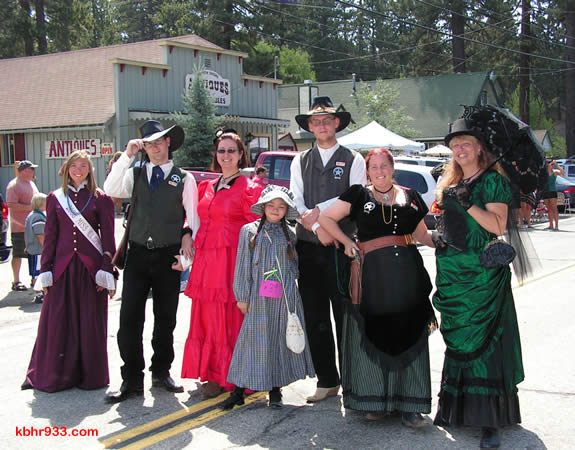 Returning Miss Clementine Keli Homan (at left) and Old Miners'-attired friends made their way to the Loggers Jubilee after the parade.