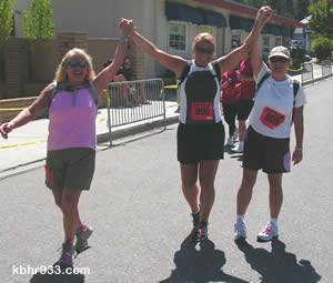 Local teachers Debi Burton, LeighAnne Drake and Alison McPherson celebrate the end of their half-marathon.
