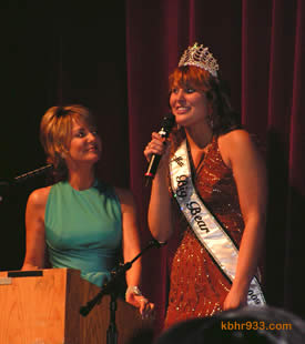 Outgoing Miss Big Bear Hayley Bracken, here with emcee Barbara Bayer-Coulter, noted that delivering Christmas gifts to a family in need was among her most rewarding experiences during her reign.
