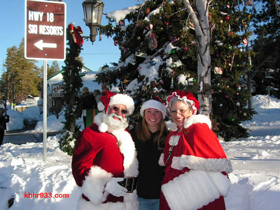 Santa and Mrs. Claus, during a sunny, post-snow day last December, with Old Miners' Days' Miss Clementine (for 2008 and 2009) Keli Homan at the Village's Christmas tree corner.