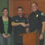 Big Bear City Fire Department's just-promoted Engineer Jim McDaniel (center), with girlfriend Stacy Gorin and Fire Chief Jeff Willis.