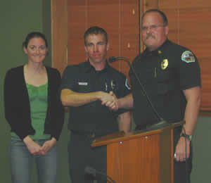 Big Bear City Fire Department's just-promoted Engineer Jim McDaniel (center), with girlfriend Stacy Gorin and Fire Chief Jeff Willis.