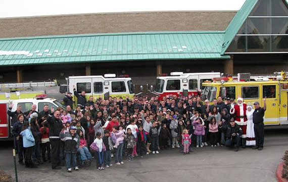 Eighty-five children, each of them singled out by their teachers for their good attitudes, were invited to join local firefighters on the 11th annual Christmas shopping spree at Kmart.